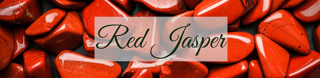 Polished Red Jasper stones in vibrant shades of red with black veining, arranged closely together, creating a bold and earthy visual.